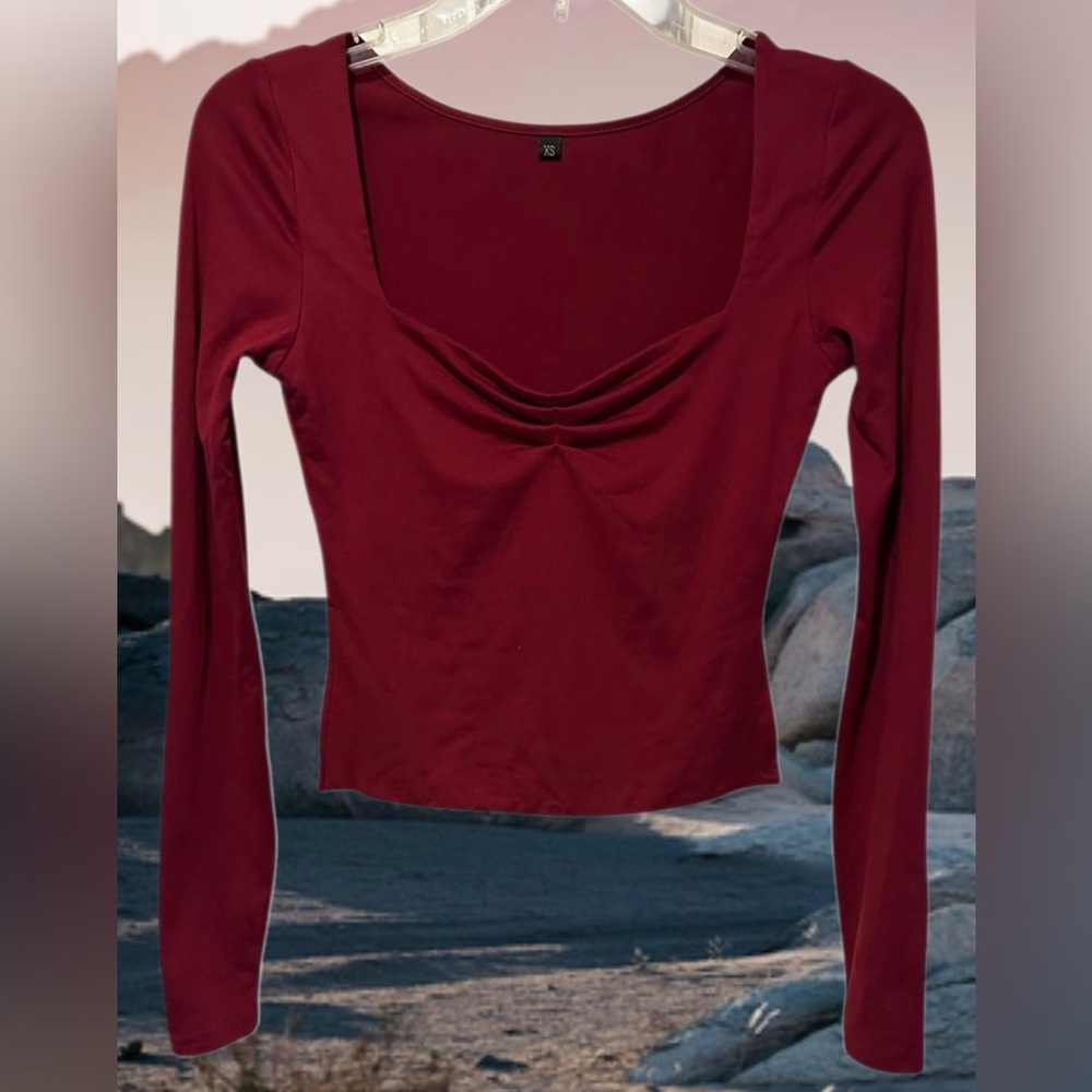 Burgandy long sleeve top with scoop neck and ruched bust